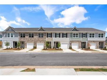 Charming townhomes with attached garages and welcoming curb appeal offer convenient living and modern design at 2520 Coventry Street, Atlanta, GA 30331