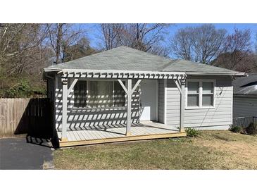 Cozy home with a welcoming front porch, new gray paint and nice architectural details at 1649 Ezra Church Nw Dr, Atlanta, GA 30314