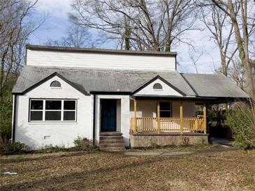Charming bungalow with a covered porch and a carport on a spacious lot at 444 Sargent Se Dr, Atlanta, GA 30315