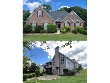 Well-maintained home with a brick facade, mature landscaping, and manicured lawn with a view of the backyard at 8008 Revere Dr, Mcdonough, GA 30252