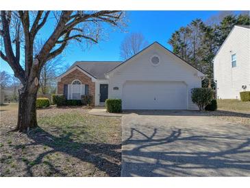 Charming one-story home featuring a two-car garage, brick accents, and well-maintained landscaping at 3165 Bellestone Ct, Marietta, GA 30066
