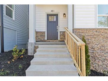 Inviting front entrance with stone accents and a light gray front door leading to this charming home at 481 Hammons Way, Atlanta, GA 30315