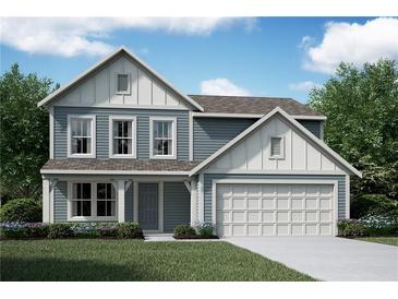 Charming two-story home with light blue siding, white trim, a two car garage, and a well-manicured lawn at 41 Okeechobee Way, Braselton, GA 30548