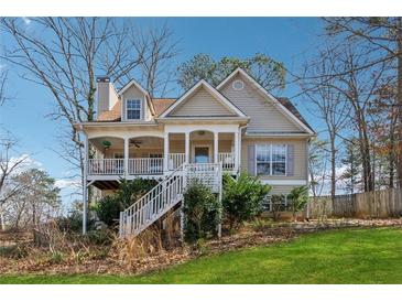 Charming two-story home with a welcoming front porch and manicured landscaping at 3080 Autumn Woods Ct, Douglasville, GA 30135