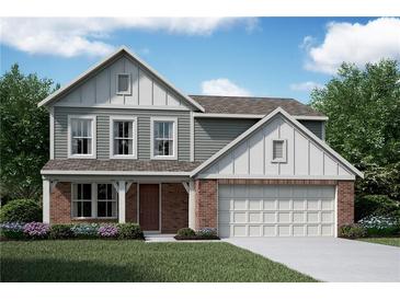 Charming two-story home with a brick and siding exterior, attached garage, and well-manicured lawn at 61 Okeechobee Way, Braselton, GA 30548