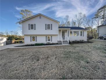 Charming two-story home with a well-maintained yard and classic architectural details at 43 Landmark Sw Ln, Marietta, GA 30060