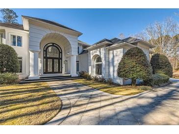 Stunning two-story home featuring a grand entrance and meticulously manicured landscaping at 490 Birkdale Dr, Fayetteville, GA 30215