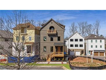 Charming new construction home with a covered porch and a well-manicured lawn at 115 Alcovy Ter, Alpharetta, GA 30009