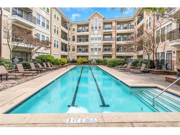 Enjoy the community pool with plenty of seating and well-maintained landscaping at 1850 Cotillion Dr # 4419, Atlanta, GA 30338