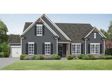 Charming single-story home with gray siding, black shutters, brick accents, and well-manicured landscaping at 1239 Pj East Rd, Covington, GA 30014