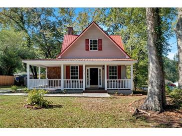 Charming home features a welcoming front porch and inviting red shutters at 116 Tallapoosa St, Temple, GA 30179