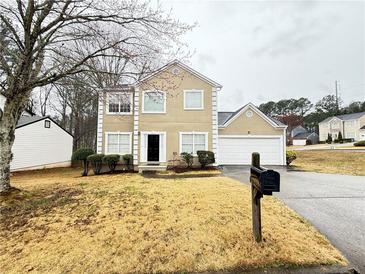 Charming two-story home with a well-maintained lawn and traditional architecture at 3060 Scepter Dr, Duluth, GA 30096