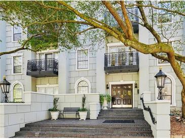 Elegant building exterior featuring balconies, decorative lamps, and a welcoming entrance at 3071 Lenox Ne Rd # 11, Atlanta, GA 30324