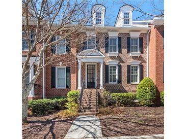 Charming brick townhouse with black shutters and a well-maintained front yard at 5002 Davenport Pl, Roswell, GA 30075