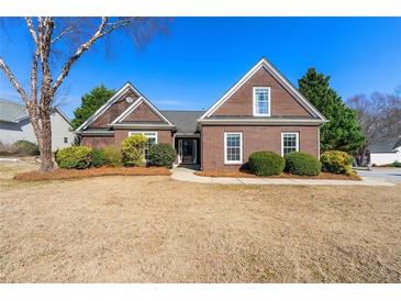 Charming single-story brick home with well-manicured landscaping and a welcoming entrance at 2955 Victoria Park Dr, Buford, GA 30519