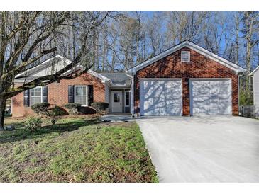 Charming brick home with an attached two-car garage and well-manicured front yard at 500 Allen'S Landing Ct, Lawrenceville, GA 30045