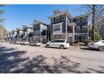 Beautiful three-story condos feature blue siding and stone accents, with ample parking available for residents and guests at 1575 Ridenour Nw Pkwy # 820, Kennesaw, GA 30152