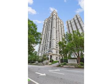 Stunning exterior of Mayfair Towers with manicured landscaping, and a view of the building's architecture at 199 14Th Ne St # 1704, Atlanta, GA 30309