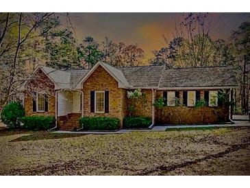 Charming single-story brick home featuring manicured landscaping and a welcoming entrance at 460 Rabbit Run, Mcdonough, GA 30252