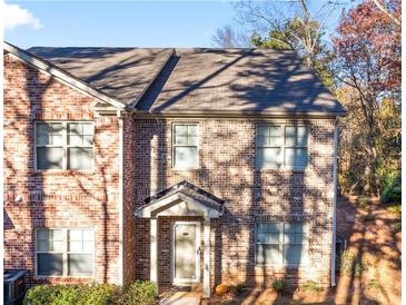 Charming two-story brick home with a cozy front porch and well-maintained landscaping at 3462 Mount Zion Rd, Stockbridge, GA 30281