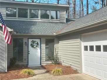 Charming home featuring an inviting entrance with a white front door and beautiful wreath detail at 3825 Emerson St, Marietta, GA 30062