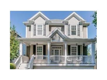 Charming two-story home featuring a welcoming front porch and craftsman-style details, and professional landscaping at 3268 Cates Ne Ave, Brookhaven, GA 30319