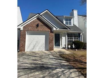 Charming home featuring brick accents, a single-car garage, and well-maintained landscaping at 4105 Ravenwood Ct # 3, Union City, GA 30291