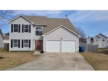 Charming two-story home with a well-maintained lawn and a two-car garage, perfect for families at 4271 Winston Cir, South Fulton, GA 30349