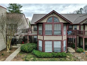 Charming townhome featuring a unique architectural design and inviting outdoor spaces at 703 Cypress Pointe St, Alpharetta, GA 30022