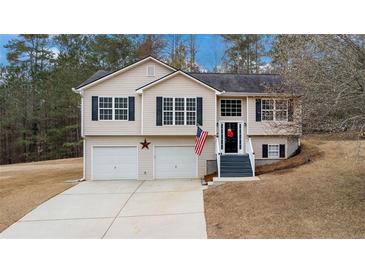 Charming two-story home with a two-car garage and well-maintained front yard at 266 Carthage Blvd, Rockmart, GA 30153