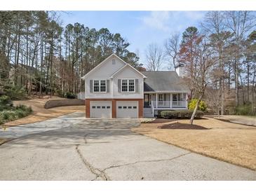 Charming two-story home with a two-car garage and a well-maintained front yard at 2157 Killian Nw Way, Kennesaw, GA 30152