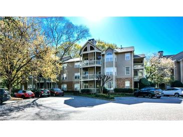 Multi-level condo building with balconies and landscaped grounds at 1315 Mcgill Park Ne Ave, Atlanta, GA 30312