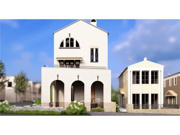 Stunning three-story home with white facade, arched entrance, and upper level balcony at 215 Rolison Way, Fayetteville, GA 30214