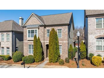 Beautiful brick home with manicured landscaping and mature trees at 4309 Elliott Way, Smyrna, GA 30082