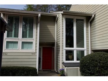 Inviting front entrance featuring a red door and large windows allowing for lots of natural light at 1932 Variations Ne Dr, Atlanta, GA 30329