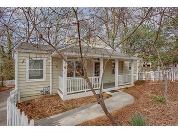 Charming single-story home with a welcoming front porch and well-maintained landscaping at 148 Murray Hill Ne Ave, Atlanta, GA 30317