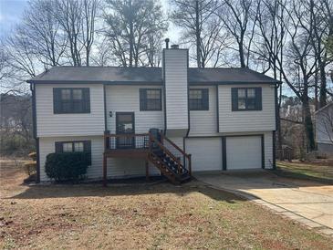 Charming two-story home with attached garage and well-maintained yard at 601 Brass Key Ct, Lawrenceville, GA 30046
