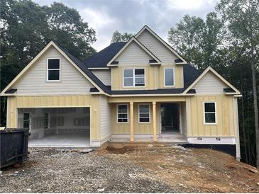 New construction two-story home with a two-car garage and classic architectural details at 221 Autumn Brook Dr, Canton, GA 30115