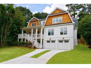 Stunning two-story home featuring a two-car garage, charming porch, and beautiful lawn at 2717 Skyland Dr, Brookhaven, GA 30319