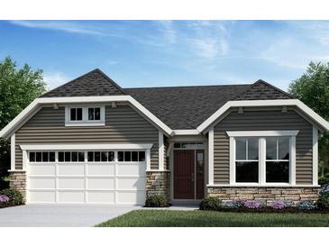 Charming single-story home featuring stone accents, a two-car garage, and a beautifully landscaped front yard at 33 Parkdale Ct, Dallas, GA 30157