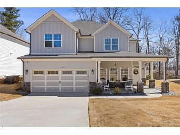 Charming two-story home with a covered porch and a two-car garage, perfect for a Gathering at 1784 Treymire Ct, Stone Mountain, GA 30088