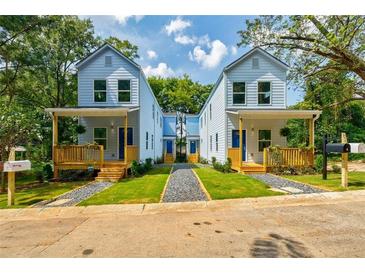 Charming blue two-story homes featuring inviting front porches and landscaped yards at 813 Smith Sw St # B, Atlanta, GA 30310