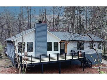 Charming home featuring a deck and a chimney at 137 Creekview Dr, Woodstock, GA 30188