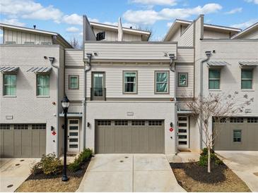 Charming townhome with a two-car garage and modern architectural details at 2712 Stargazer Ter, Smyrna, GA 30080