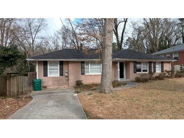 Charming single-story home with a well-maintained lawn and driveway at 2689 Rollingwood Se Ln, Atlanta, GA 30316
