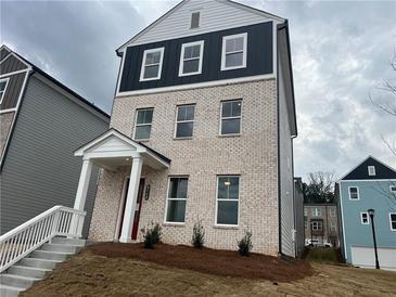 Charming three-story home with brick and modern accents at 2715 Stream Valley Lane Nw Nw Cir, Atlanta, GA 30318