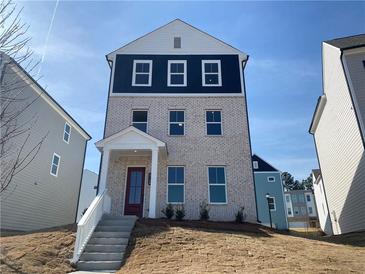 Charming two-story home with a brick facade and a welcoming red door with white trim at 2715 Stream Valley Lane Nw Nw Cir, Atlanta, GA 30318