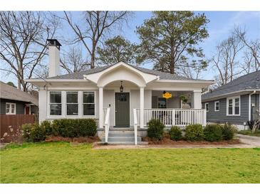 Charming bungalow-style home with a well-manicured lawn and inviting front porch at 1613 Westwood Sw Ave, Atlanta, GA 30310