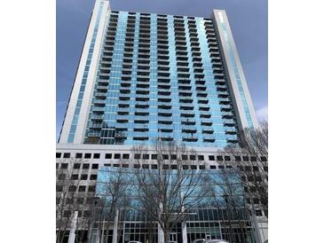 Modern high-rise building with glass facade and multiple balconies offering city views at 3324 Peachtree Ne Rd # 1116, Atlanta, GA 30326