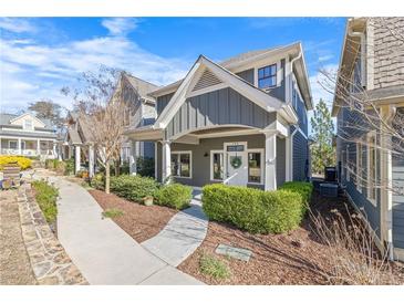 Charming two-story home with covered porch, manicured landscaping, and a welcoming front entrance at 196 Wingo St, Norcross, GA 30071